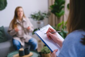 Patient sharing their health history during a naturopathic appointment.