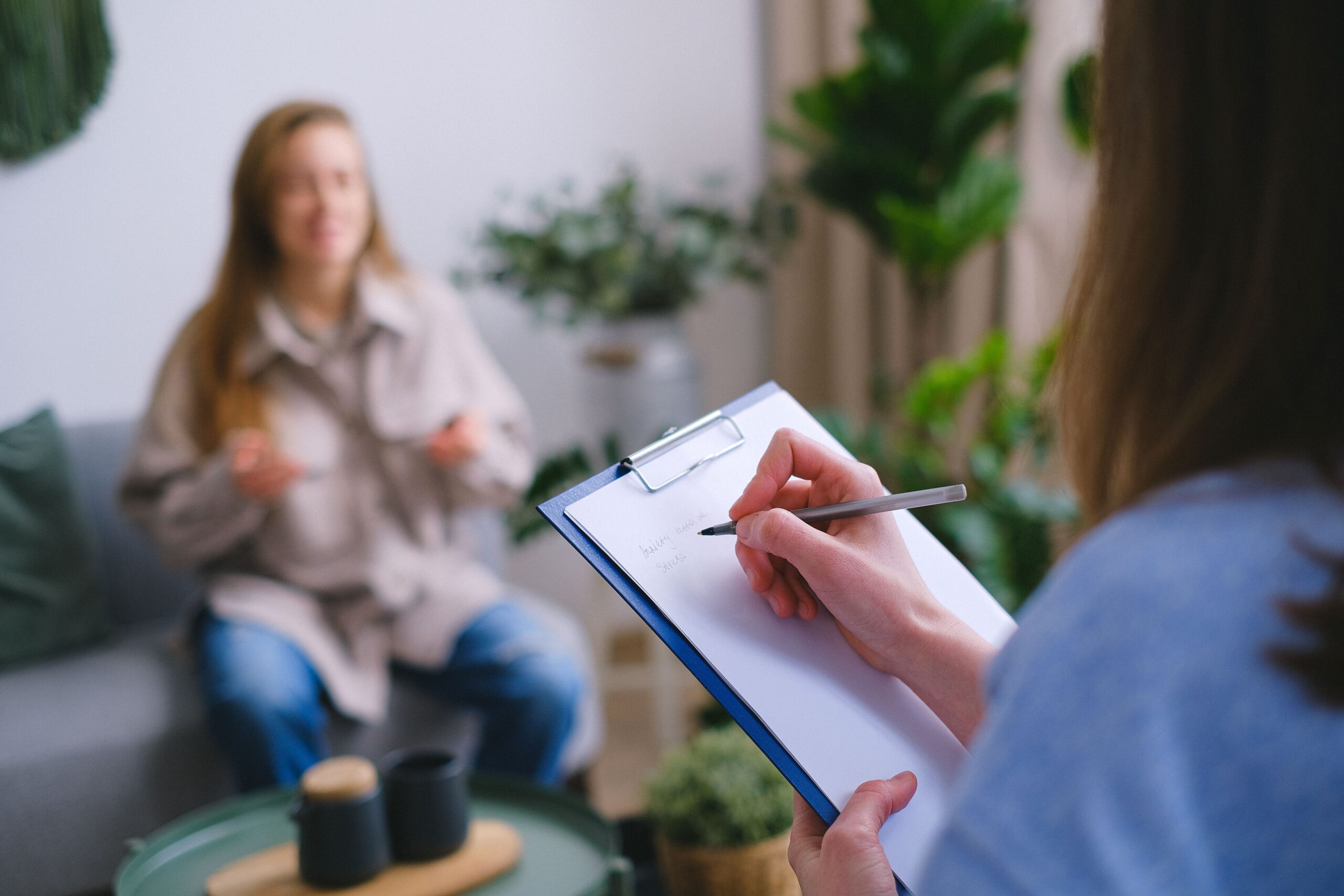 Patient sharing their health history during a naturopathic appointment.